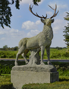 A LARGE AND IMPRESSIVE SCULPTED LIMESTONE AND ANTLER MOUNTED MODEL OF A STAG, LATE 20TH CENTURY