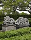 A PAIR OF SCULPTED LIMESTONE MODELS OF RECUMBENT LIONS, SECOND HALF 20TH CENTURY, AFTER ANTONIO CANOVA (VENETIAN 1757-1822)