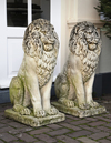 A PAIR OF COMPOSITE STONE MODELS OF SEATED LIONS, SECOND HALF 20TH CENTURY
