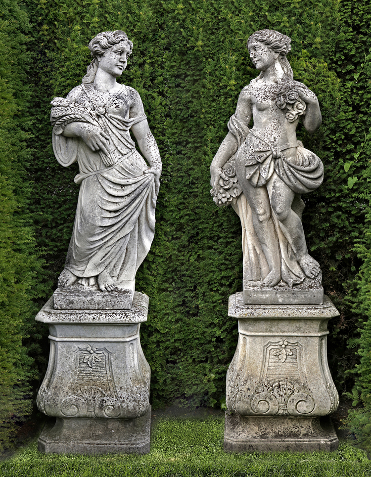 A PAIR OF CONTINENTAL SCULPTED LIMESTONE MODELS REPRESENTING SPRING AND SUMMER, 20TH CENTURY