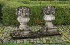 A PAIR OF CARVED LIMESTONE PIER FINIALS IN THE FORM OF FRUITING BASKETS, LATE 19TH OR EARLY 20TH CENTURY