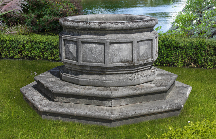 A LARGE CARVED STONE OCTAGONAL WELLHEAD/PLANTER, LATE 19TH CENTURY