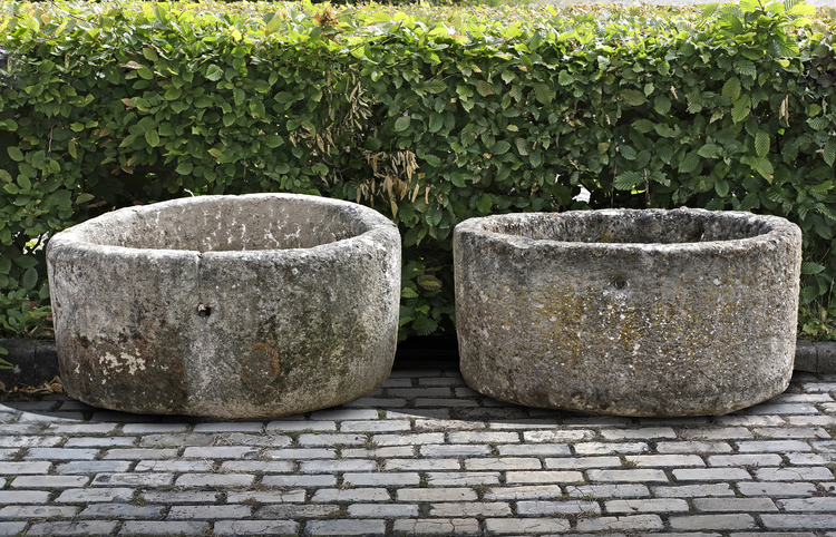 TWO SIMILAR CIRCULAR CARVED LIMESTONE TROUGHS, 19TH CENTURY