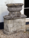 A FRENCH CARVED LIMESTONE OVAL CISTERN, 19TH CENTURY