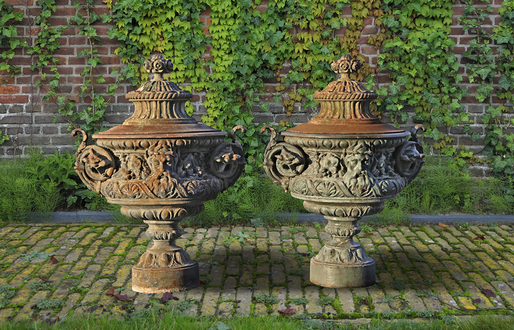 A PAIR OF ORNATE CAST IRON GARDEN URNS AND COVERS PROBABLY FRENCH, LAST QUARTER 19TH CENTURY