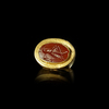 A HELLENISTIC GOLD RING WITH AN INTAGLIO SHOWING A LOCUST, 2ND/3RD CENTURY BC