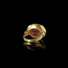 A ROMAN GARNET INTAGLIO SHOWING A SHIP SET IN A MODERN RING, 1ST CENTURY AD, RING 20TH CENTURY