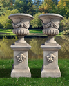 A  PAIR OF CARVED LIMESTONE GARDEN URNS, LATE 20TH CENTURY