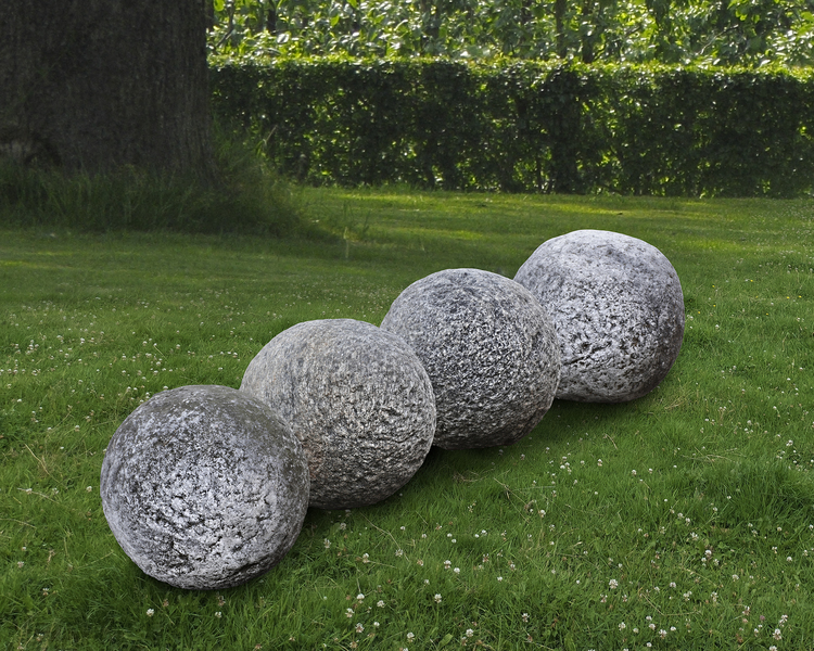 A GROUP OF FOUR STONE ORNAMENTAL SPHERES, LATE 18TH CENTURY