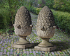 A PAIR OF CARVED LIMESTONE PIER FINIALS, 20TH CENTURY
