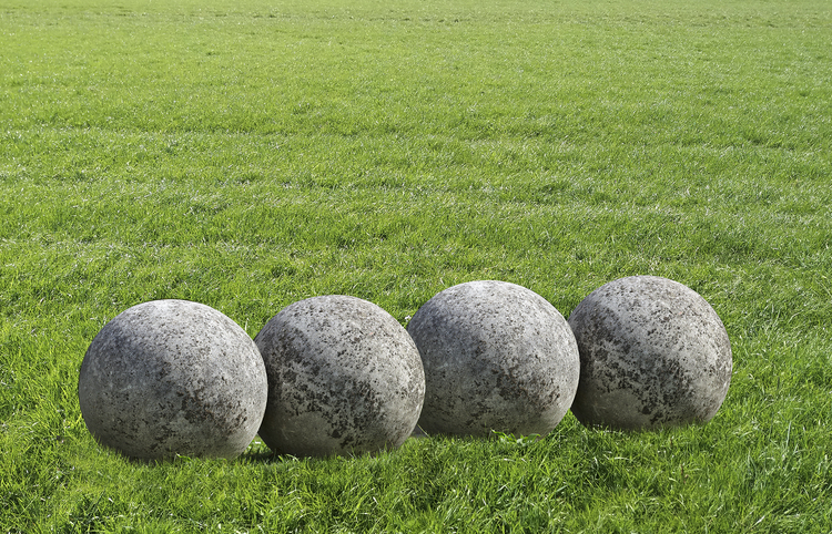 A GROUP OF FOUR LIMESTONE ORNAMENTAL SPHERES, LATE 20TH CENTURY