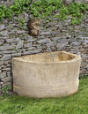 A FRENCH CARVED PIERRE DE BOURGOGNE LIMESTONE BASIN, 18TH CENTURY