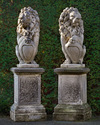 A PAIR OF SCULPTED LIMESTONE MODELS OF HERALDIC LIONS, SECOND HALF 20TH CENTURY
