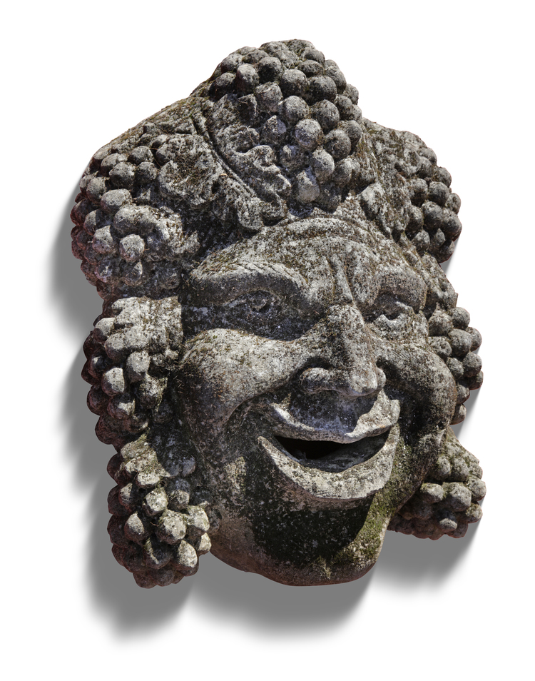 A SCULPTED CARVED LIMESTONE BACCHUS WALL FOUNTAIN MASK, 20TH CENTURY