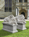 A PAIR OF SCULPTED LIMESTONE MODELS OF SLEEPING LIONS, MID 20TH CENTURY, LOOSELY AFTER THE MANNER OF ANTONIO CANOVA (VENETIAN 1757-1822)