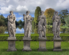A SET OF FOUR SCULPTED LIMESTONE MODELS OF MAIDENS REPRESENTING THE FOUR SEASONS, LATE 19TH OR EARLY 20TH CENTURY