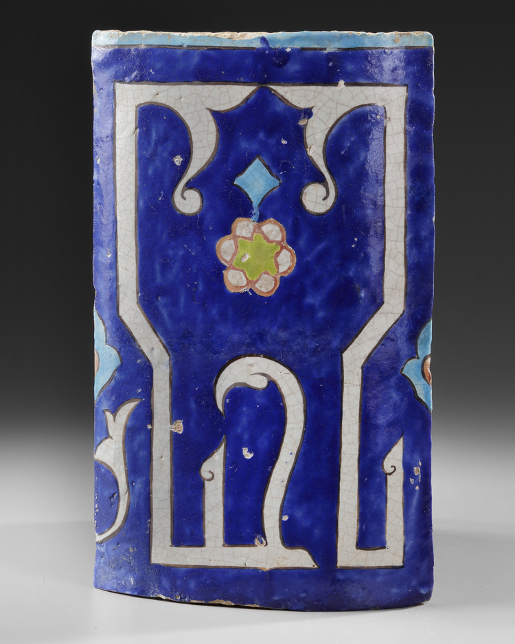 A TIMURID CALLIGRAPHIC POTTERY TILE, CENTRAL ASIA OR EASTERN PERSIA, 14TH-15TH CENTURY