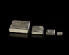 FOUR BYZANTINE COMMERCIAL WEIGHTS WITH SILVER INLAY, 5TH-7TH CENTURY AD