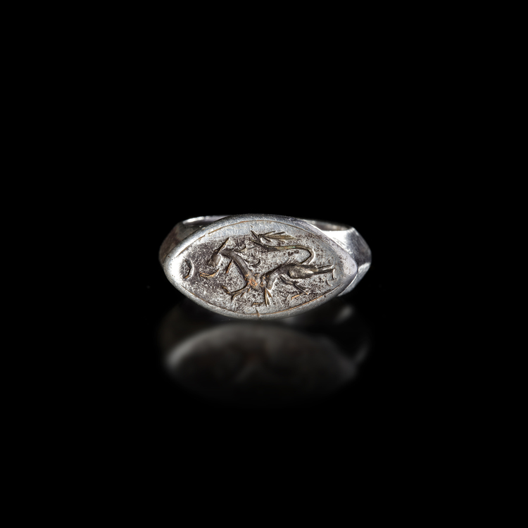 A SELJUK SILVER RING WITH A RUNNING DRAGON, 12TH-13TH CENTURY AD