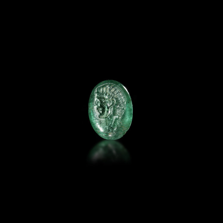 AN EMERALD INTAGLIO SHOWING THE BUST OF A MAN, 1ST CENTURY BC