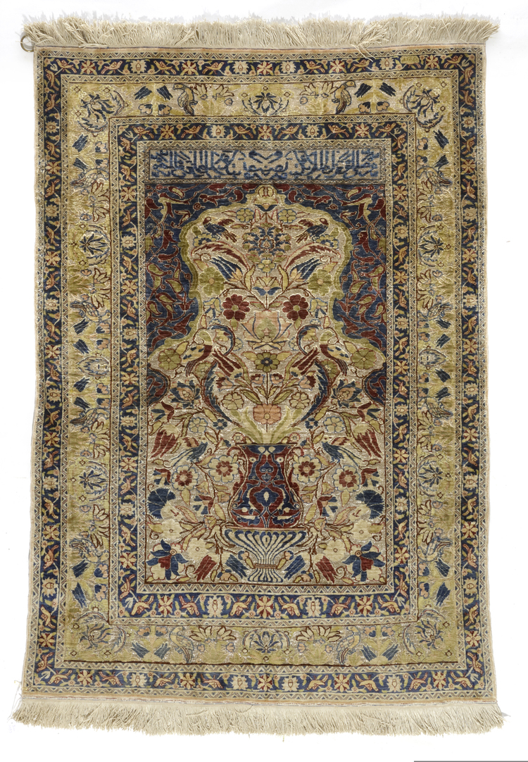 A FINE SILK AND METAL TURKISH HEREKE SILK RUG