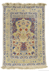 A FINE SILK AND METAL TURKISH HEREKE SILK RUG