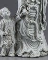 AN EXCEPTIONAL LARGE DEHUA GLAZED FIGURE OF A GUANYIN WITH A CHILD, 20TH CENTURY