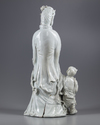 AN EXCEPTIONAL LARGE DEHUA GLAZED FIGURE OF A GUANYIN WITH A CHILD, 20TH CENTURY