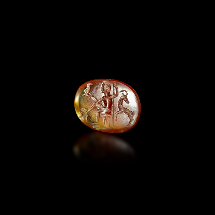 ROMAN CARNELIAN INTAGLIO WITH JUPITER SEATED. 1/2nd.c.A.D.