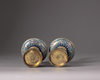 A pair of Chinese cloisonné candle-stands