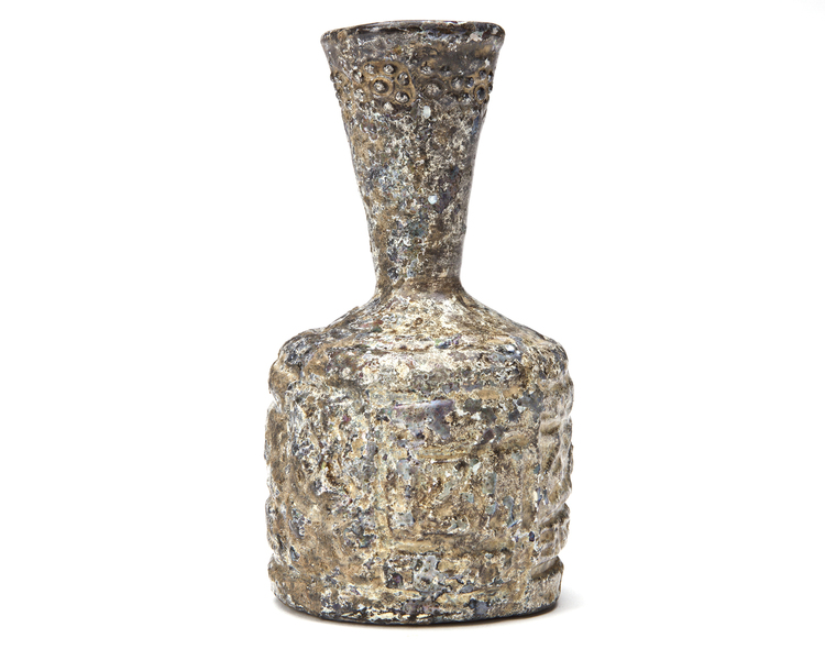 A NISHAPUR RELIEF CUT-GLASS BOTTLE, PERSIA, 9TH CENTURY