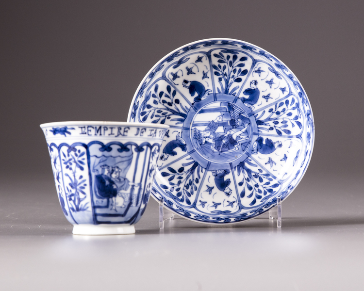 A blue and white tea-cup and saucer