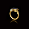 A GOLD RING WITH A BLUE GLASS INLAY, 1ST CENTURY AD OR LATER