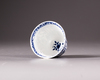 A blue and white tea-cup and saucer