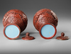 TWO CARVED CINNABAR LACQUER STEM-BOWLS AND COVERS, 19TH-20TH CENTURY