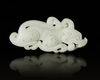 A CHINESE WHITE JADE BUDDHIST LION PENDANT, 20TH CENTURY