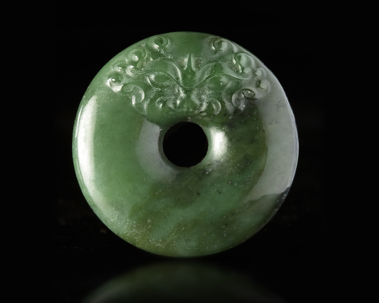 A CHINESE SPINACH JADE CARVED DISC PENDANT, 20TH CENTURY