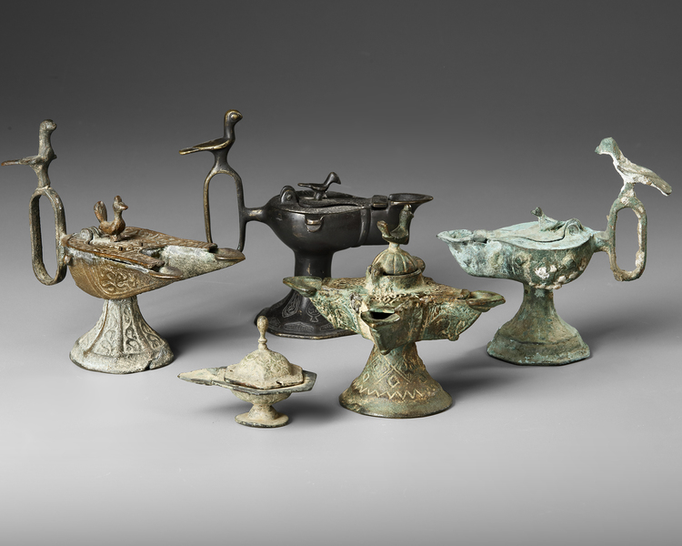 SIX PERSIAN BRONZE OIL LAMPS, SELJUK 12TH-13TH CENTURY AND LATER
