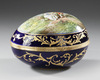 AN EGG SHAPED LIMOGES PORCELAIN JEWELRY BOX, SIGNED, LATE 19TH CENTURY