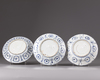 Three blue and white plates