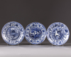 Three blue and white plates