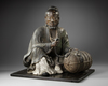 A JAPANESE SEATED LEGENDARY FIGURE WITH HAY BALE, 18TH CENTURY