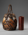 A JAPANESE BAMBOO IKEBANA BASKET, TAISHO PERIOD (1912-1926)