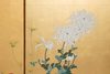 A JAPANESE BYOBU FLOWER GARDEN ON GOLD LEAF, MEIJI PERIOD (1868-1912)