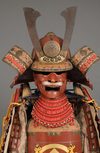 A RED LACQUER JAPANESE SUIT-OF-ARMOUR BY SATSUMA KUNIZUMI, 11TH GENERATION MITSUNOBU, MID 20TH CENTURY
