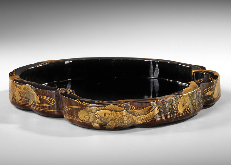 A JAPANESE IRREGULAR SHAPED BLACK LACQUERED WOODEN TRAY,  MEIJI PERIOD (1868-1912)