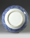 A JAPANESE BLUE AND WHITE  DOUBLE- GOURD SAKE VASE, WITH OCTOPUS AND KARAKUSA, LATE EDO PERIOD, 18TH CENTURY