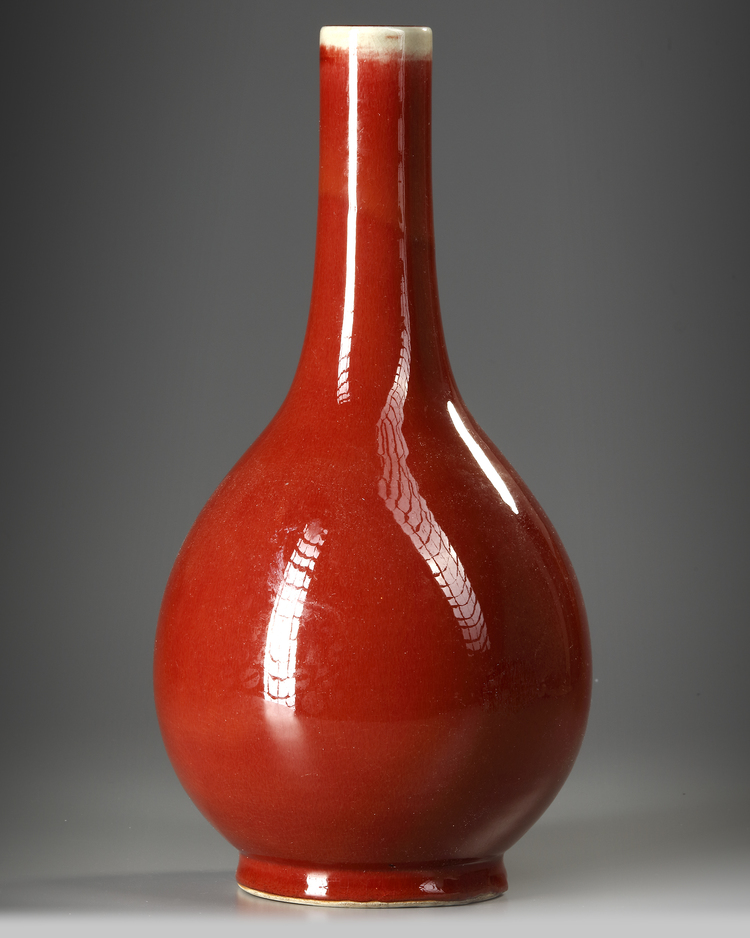 A CHINESE COPPER-RED-GLAZED BOTTLE VASE,QING DYNASTY (1644-1911)