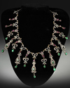 A SILVER NECKLACE SET WITH GEMSTONES
