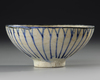 A KASHAN POTTERY BOWL, PERSIA, EARLY 13TH CENTURY